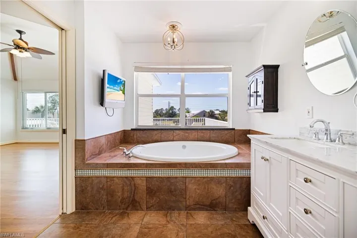 Master bath with soaking tub and plenty of natural light.