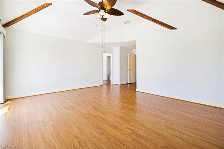 Master bedroom with vaulted ceilings.