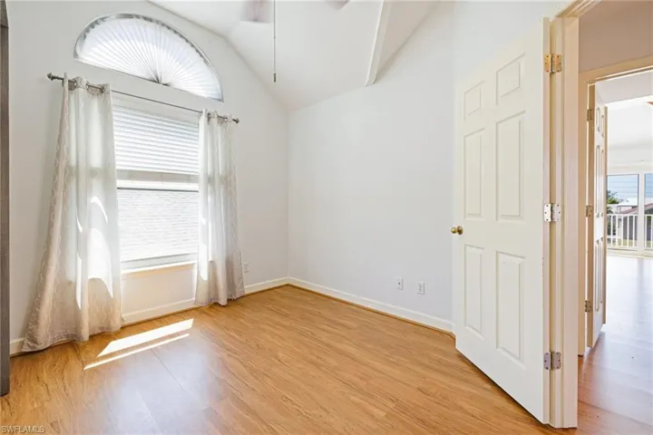 Third floor guest bedroom with vaulted ceilings and plenty of nautral light.