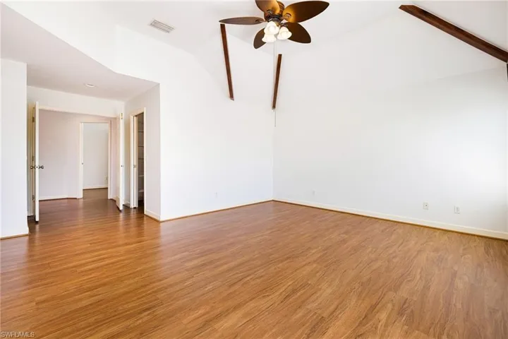 Master bedroom with vaulted ceilings.