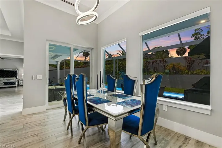 Dining area featuring wood finished floors and a chandelier