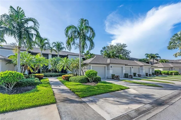 View of front of home with concrete driveway and a garage