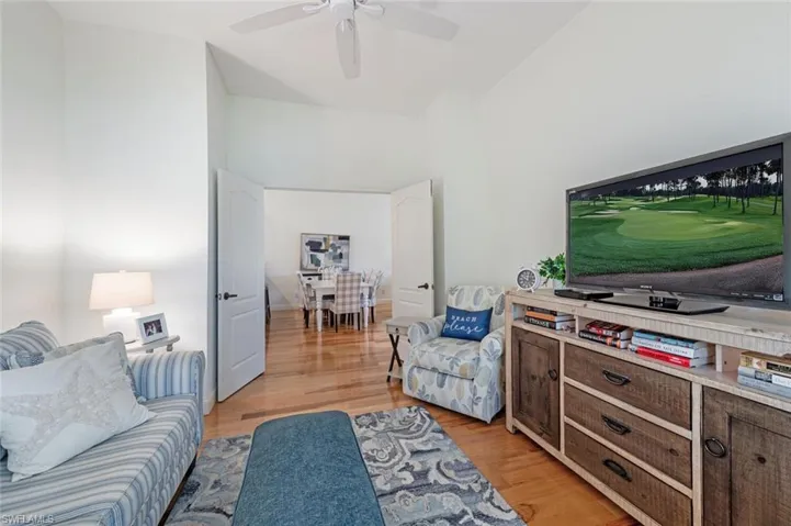 Living room with light wood-style flooring