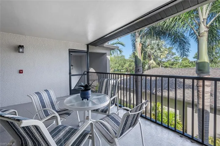 Balcony featuring a sunroom
