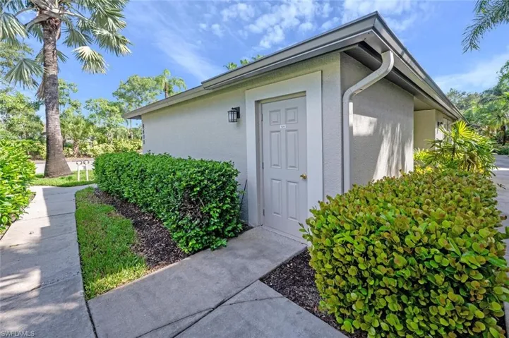 View of exterior entry with stucco siding