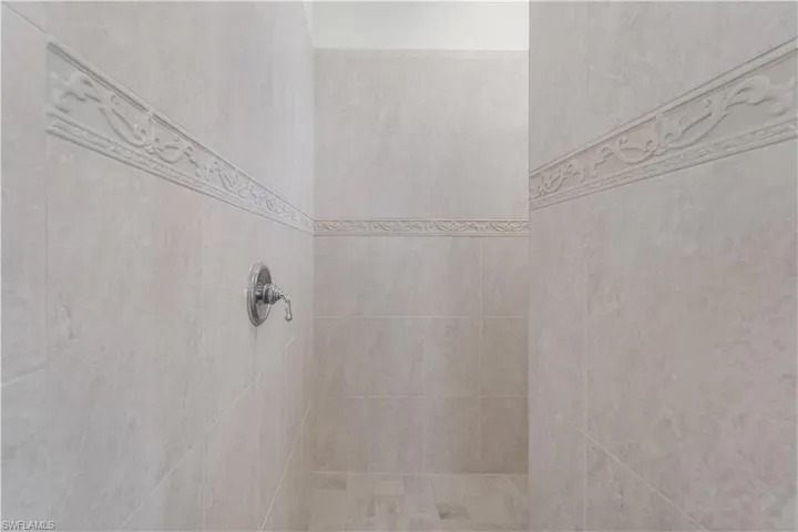 Bathroom view of tiled shower