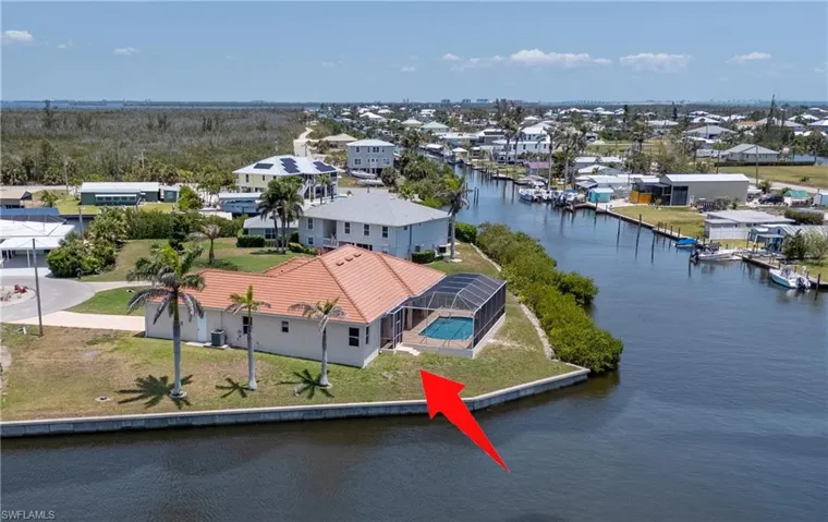 Aerial perspective of suburban area with a large body of water