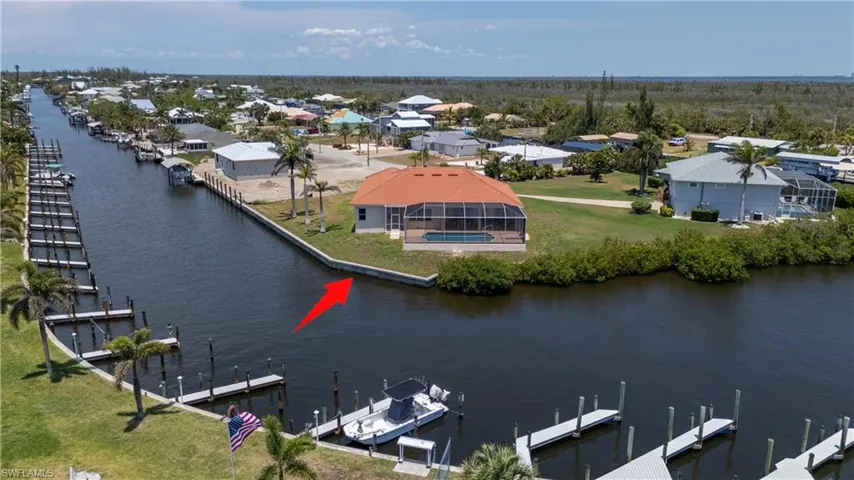 Aerial perspective of suburban area with a nearby body of water