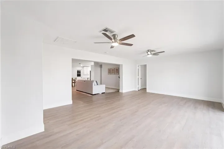 Spare room featuring light wood finished floors and ceiling fan