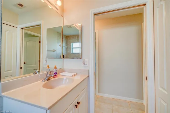 Bathroom featuring vanity and tile patterned flooring