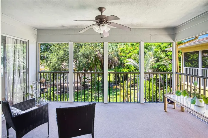 Sunroom / solarium with a ceiling fan