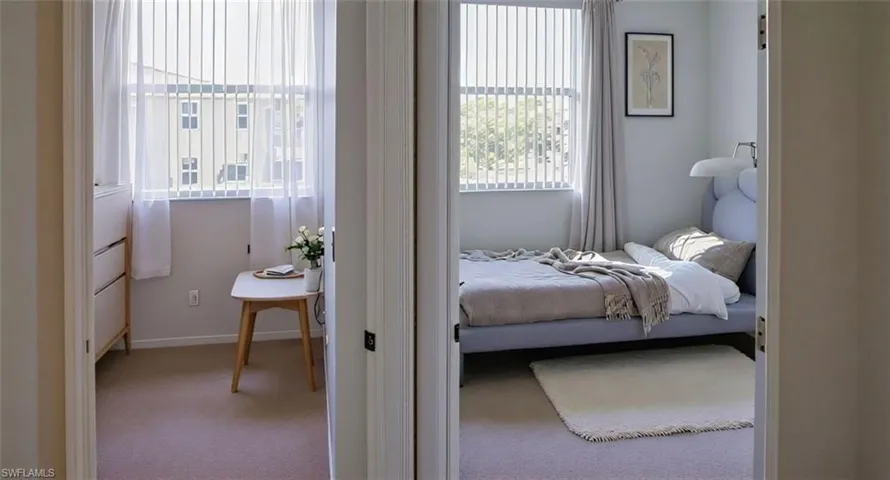 Carpeted bedroom featuring baseboards. virtual staggered