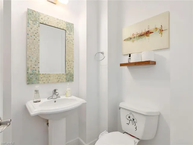Half bathroom featuring toilet
