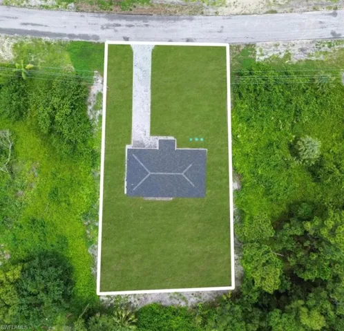 Aerial view of property and surrounding area featuring property boundaries highlighted