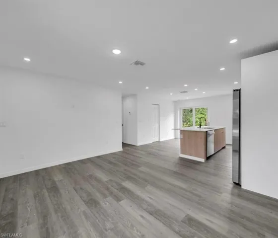 Unfurnished living room with recessed lighting and light wood finished floors