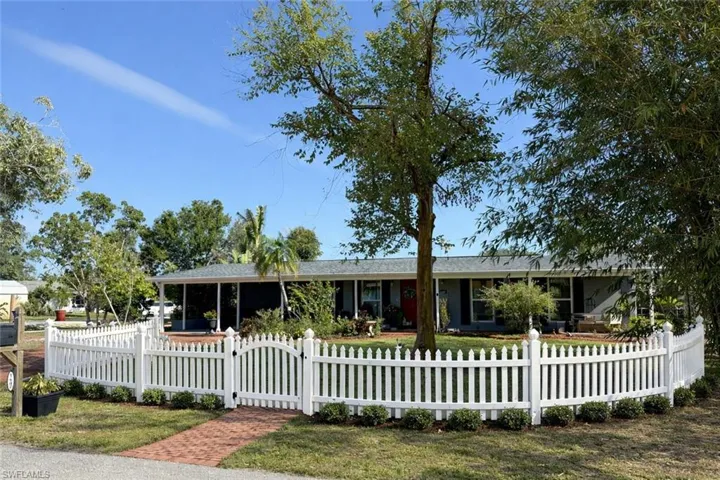 AI generated photo to show a front fenced yard.