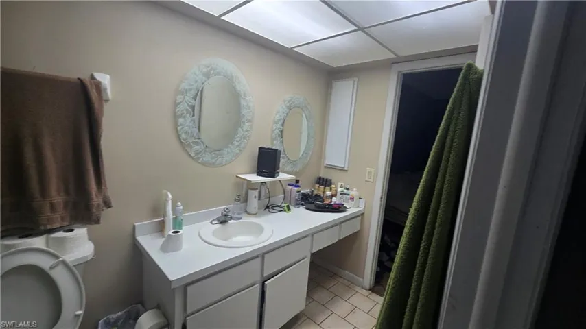 Bathroom with vanity and light tile patterned floors