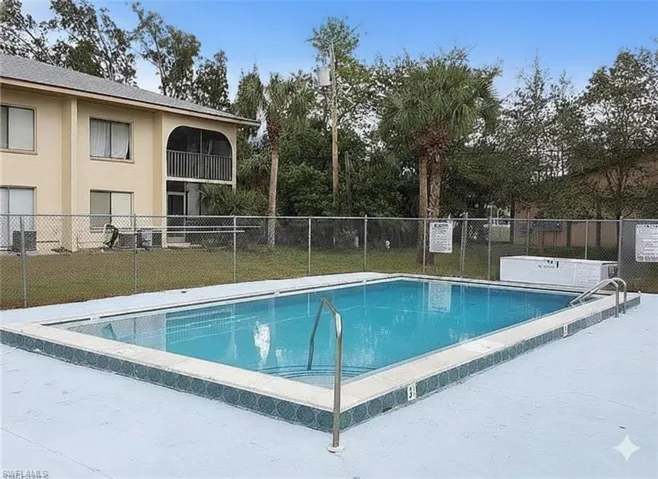 Community pool with a patio