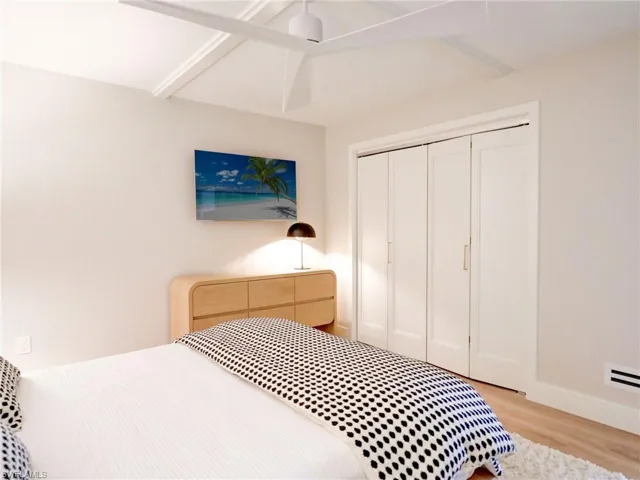 Bedroom featuring a closet and light wood-type flooring