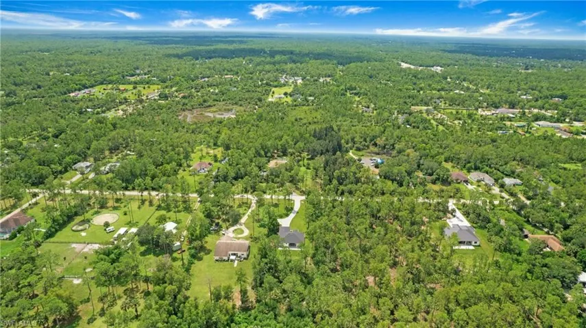 View of property location with a forest
