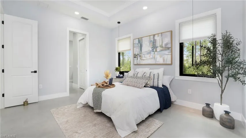 Bedroom with recessed lighting and ornamental molding