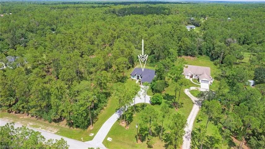 View of property location with a forest
