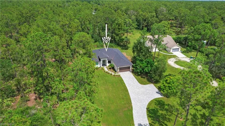 View from above of property featuring a forest