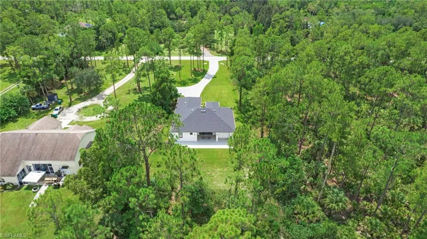 View of property location with a forest