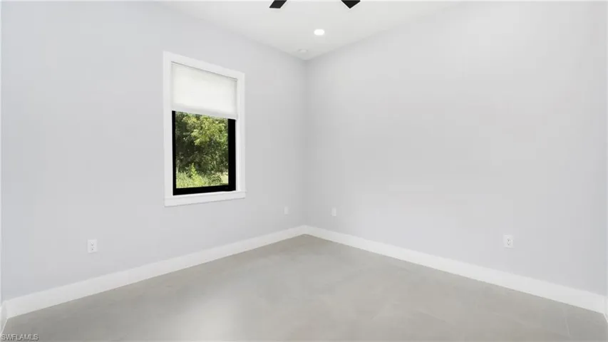 Spare room with recessed lighting and a ceiling fan
