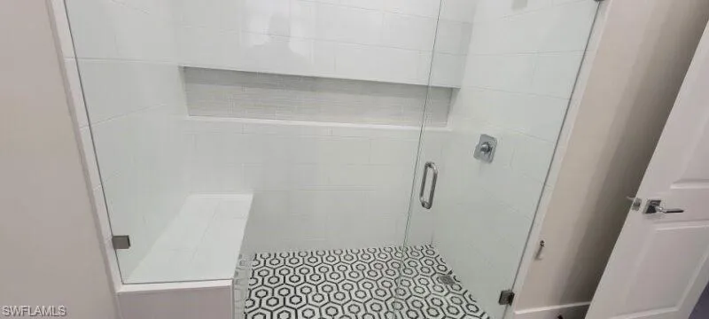 Full bath featuring a stall shower