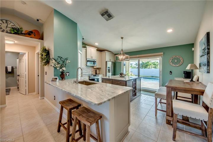 WELCOME to your dream kitchen!  A perfect place to gather around the large kitchen island and bar!