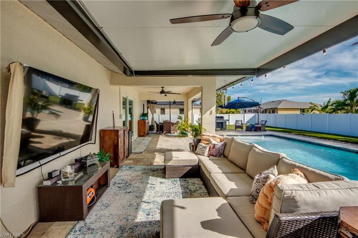 Full length view of the back patio and lanai - two covered extensions to the patio provide plenty of shade and cover to enjoy the outdoors!