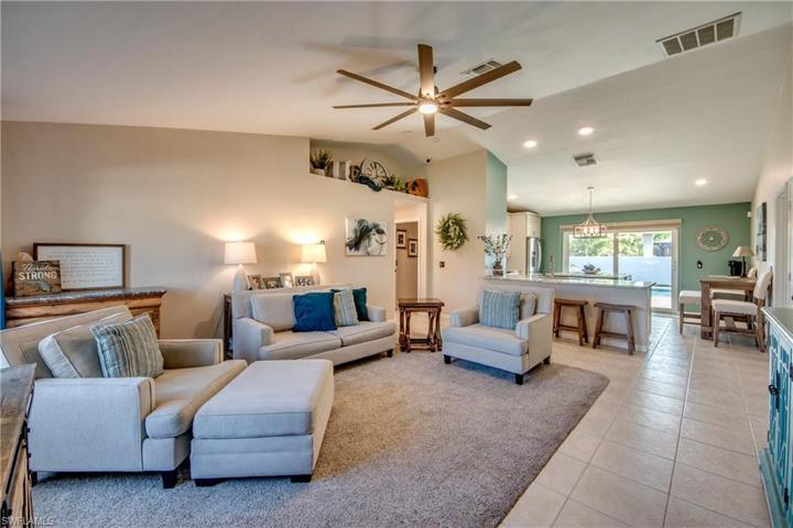 A serene and flowing floor plan with plenty of room for large furniture and open to the kitchen and dining area.  This home would also make a great vacation rental!