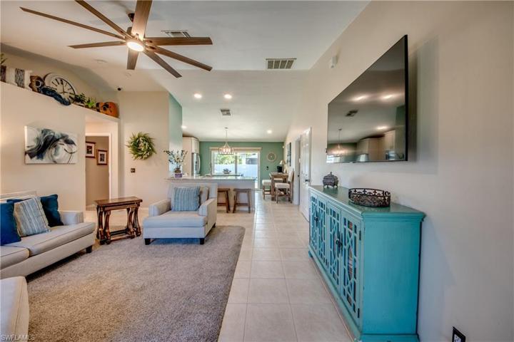Soaring vaulted ceilings, neutral paint palette and lots of natural light throughout the home!  Large wall spaces to showcase your art and beautiful plant shelves add additional charm to this already charming home!