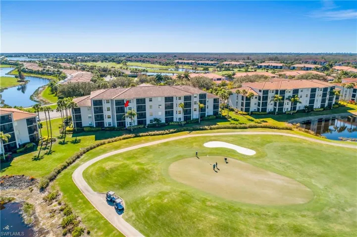 Bird's eye view of a large body of water and a local golf course red arrow points to home's lanai