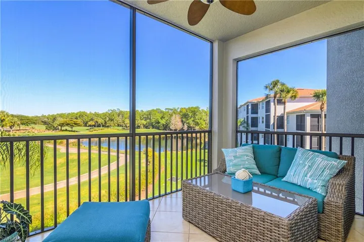 Lanai featuring a ceiling fan, a balcony, tile patterned floors, a textured ceiling, and an outdoor hangout area