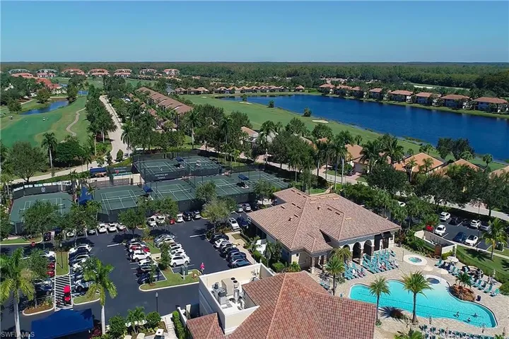 Bird's eye view of the resort style pool, Tennis Courts, a nearby body of water and a golf club