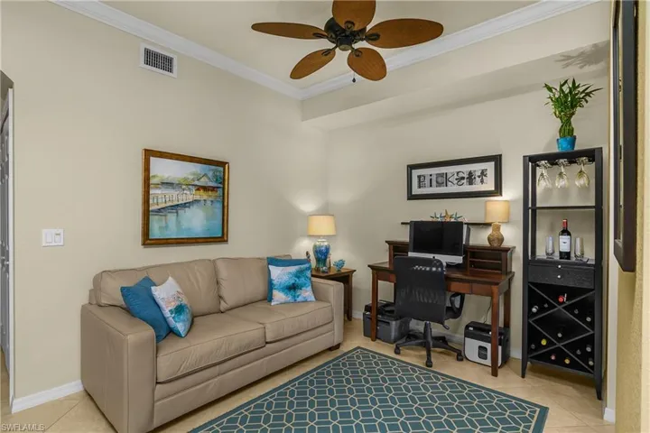 Office/Dining Room featuring crown molding, light tile patterned floors, and ceiling fan