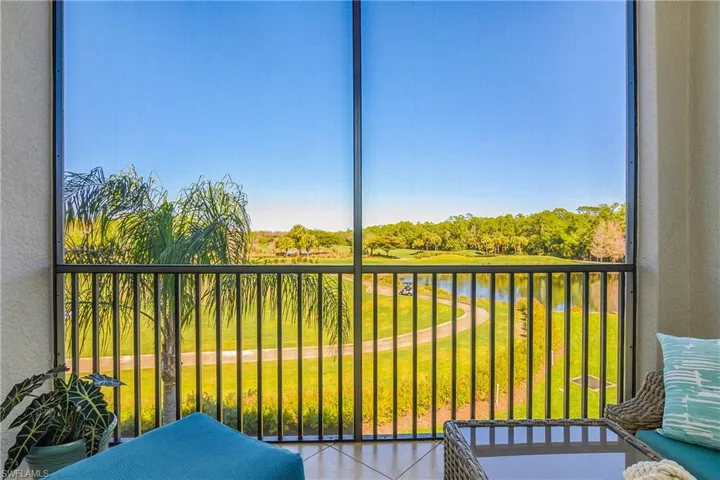 Balcony with a Lanai, a water view, and view of the lake and preserve