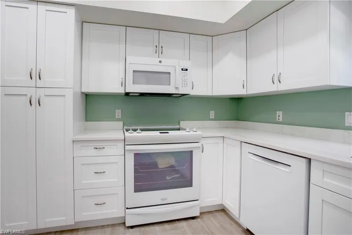 New White Shaker soft close cabinetry.