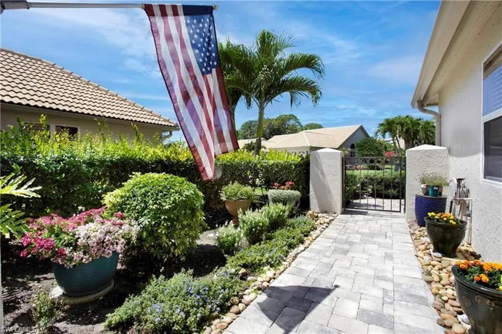 Private gate and beautiful flowers lead you to your entrance.