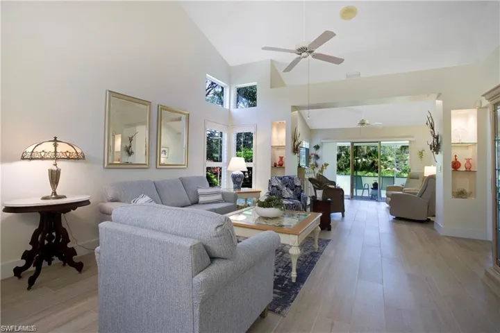 Great Room leads you to another flex space/sitting area with views of the lush landscape.