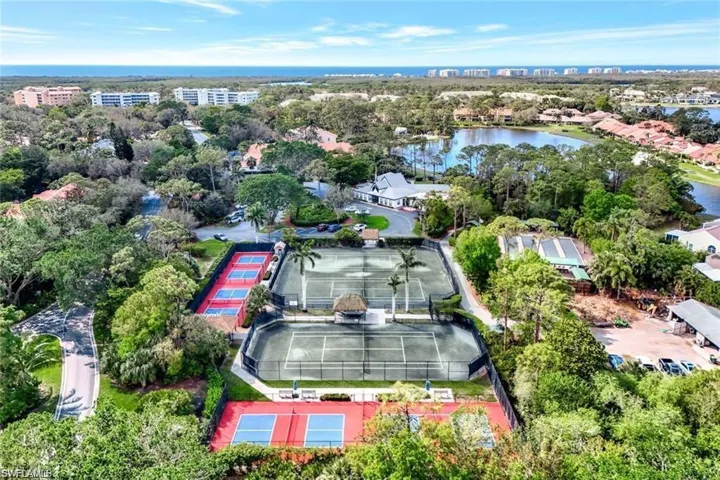 Community Clubhouse surrounded by pickleball, tennis, bocce ball, and shuffleboard.