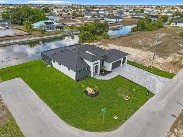 Aerial perspective of suburban area with a large body of water