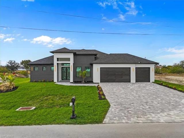 Prairie-style house with decorative driveway, roof with shingles, an attached garage, a front lawn, and stucco siding