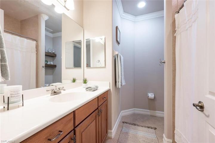 Guest Bathroom has Wood Cabinetry.