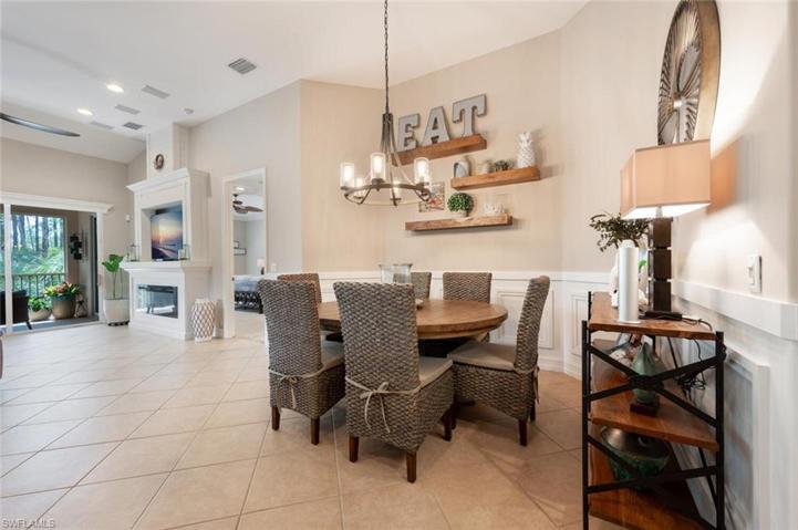 Roomy Dining Area. Wainscoting Detailing on Walls, Floating Wood Shelves.