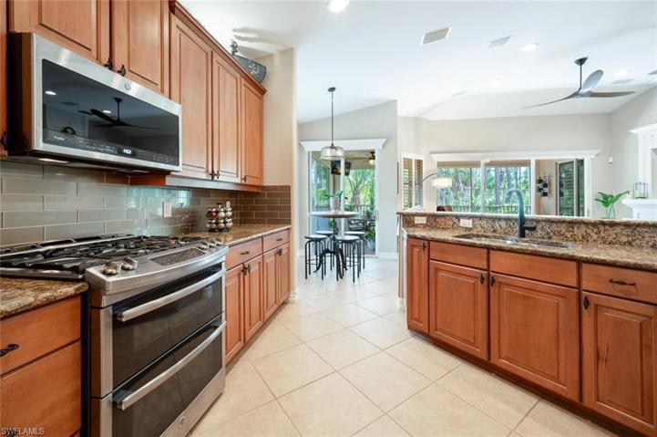 Updated SS Appliances (Headless Natural Gas Range), 42'' Maple Wood Cabinets, Granite, Double Sink, Upgraded Faucet, Backsplash, upper/under Cabinet Lighting.