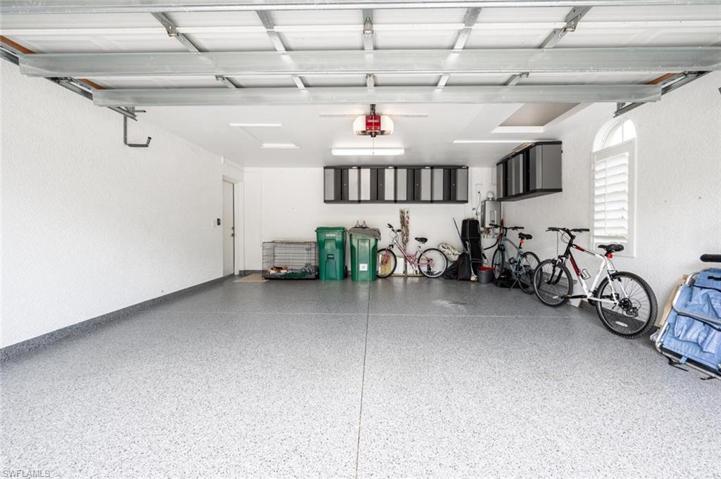 2 Car Garage with Built-In Storage, Window with Plantation Shutter, New Flooring, New Liftmaster garage door opener with quiet belt & camera. Tankless Gas Hot Water Heater.