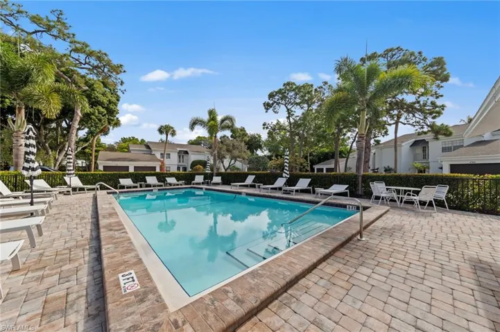 Community pool featuring a patio